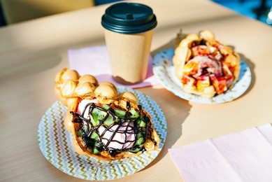 the hong kong waffles and paper coffee cup