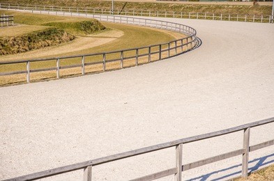 curve on empty horse race arena - photo with copy space