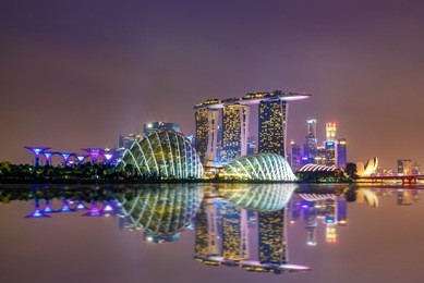 singapore skyline. singapore`s business district, blue sky and night view for marina bay