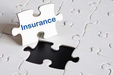 insurance concept with white puzzle or jigsaw