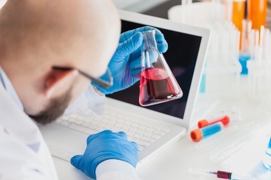 man researcher carrying out scientific research.