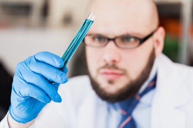 man researcher carrying out scientific research.