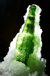 close up view of the bottle in ice