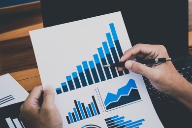business technology concept,business people discussing the charts and graphs showing the results of their successful teamwork,selective focus. 