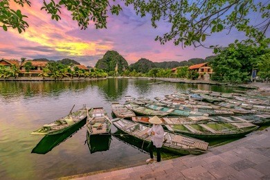 rowing boat waiting for passengers at sunrise,hoa lu tam coc,hoi an ancient town,vietnam.
