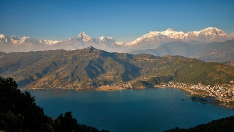evening view of pokhara and phewa lake with himalaya mountains at the background from world peace pagoda in pokhara, nepal