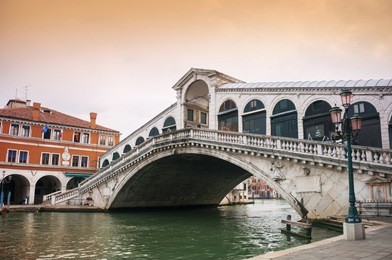 rialto bridge in venice during the sunset
