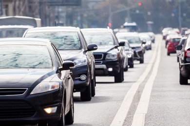 zoom view of the road with grey cars in the rush hour