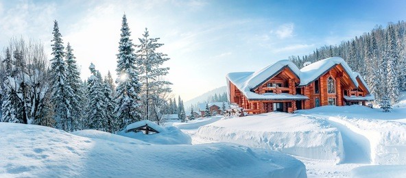 winter house on winter snowy panoramic landscape