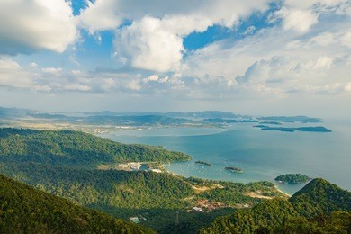 panoramic view of blue sky, sea and mountain seen from cable car viewpoint, langkawi, malaysia. picturesque landscape with beaches, small islands and tourist ships at waters of strait of malacca