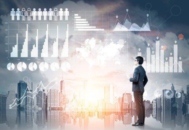 side view of a businessman with a coffee cup looking at graphs on a glassboard. gray city. toned image. elements of this image furnished by nasa