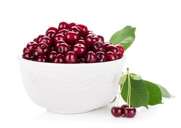 fresh ripe cherries in bowl. isolated on white background