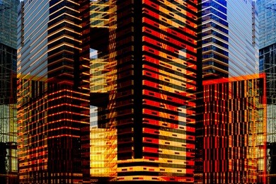 skyscrapers / multistory office buildings by night and by day. contemporary architecture. modern cityscape fragment. reworked photo of downtown business district.