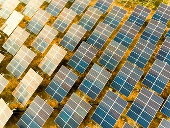 beautiful sunset over solar farm with sunset on the background