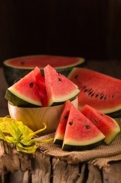 watermelon slice on a rustic wood background.