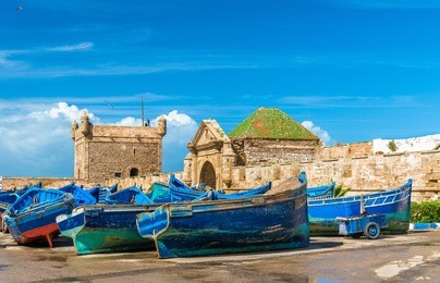 blue fishing boats in the port of essaouira - morocco