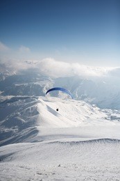 winter paragliding in gudauri mountains.