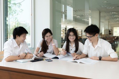 group of asian students in uniform studying together at classroom. asian students looking happy to study. education, student, people concept.
