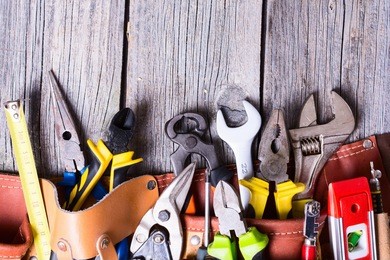 set of tools on wooden background .