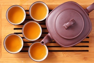 asian tea set on bamboo mat,closeup.