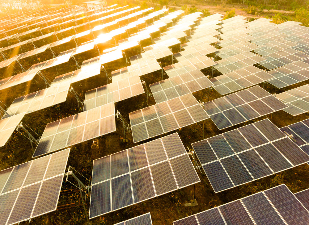 beautiful sunset over solar farm with sunset on the background
