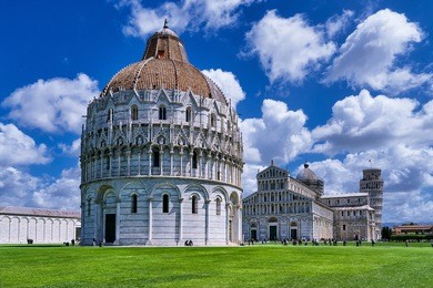 piazza dei miracoli with famous leaning tower in pisa, tuscany, italy.