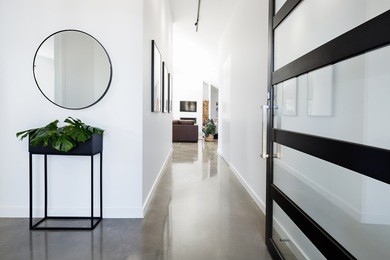 contemporary home entry hall with polished concrete floors
