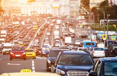 rush hour on the city highway with warm sunlight
