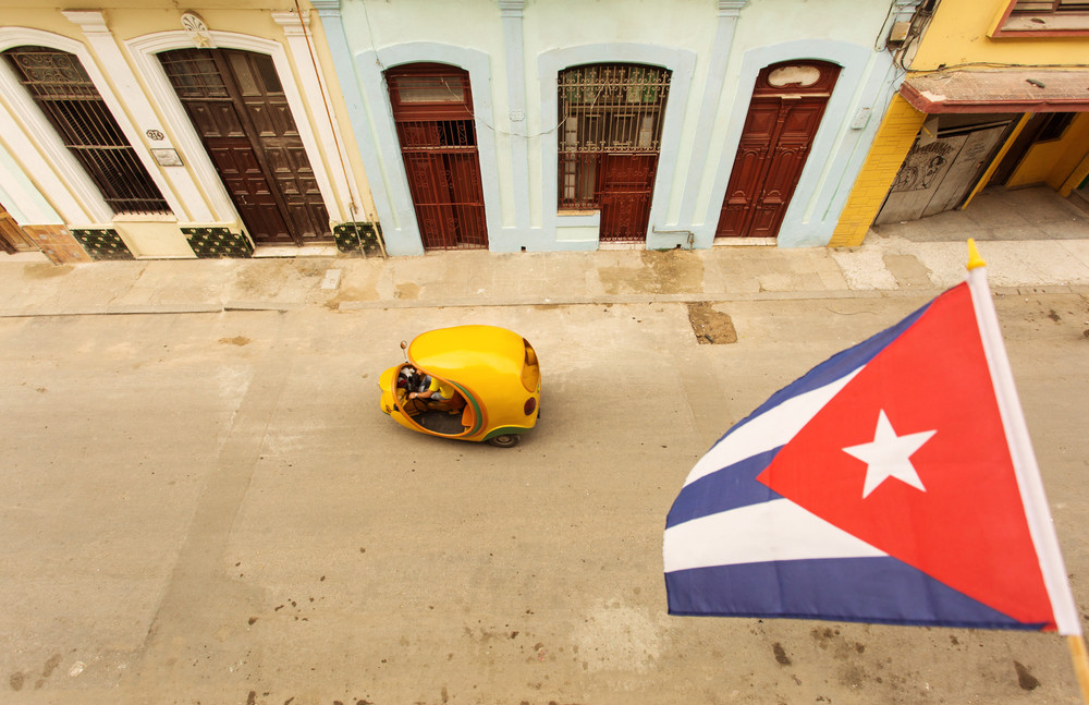 coco taxi view from above with cuba flag, street of havana.