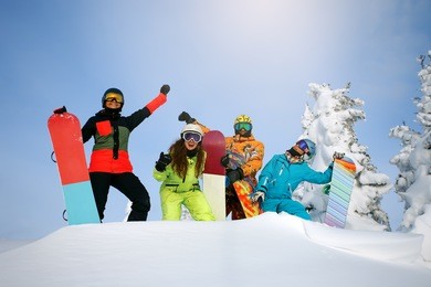 group happy friends having fun at sheregesh ski resort. skiers and snowboarders team concept