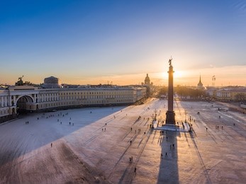aerial view of palace square and alexander column at sunset, a gold dome of st. isaac's cathedral, the winter palace, the hermitage, peter and paul fortress, triumphal chariot, little people walks