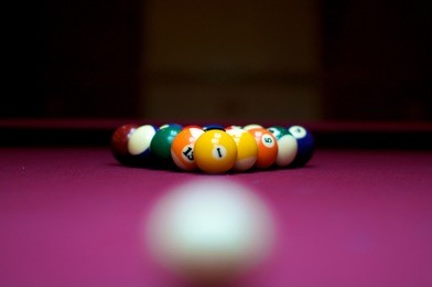 pool billard ball on red cloth