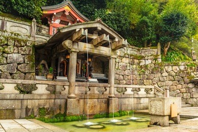 three streams of otowa waterfall at kiyomizu-dera temple in kyoto, japan.