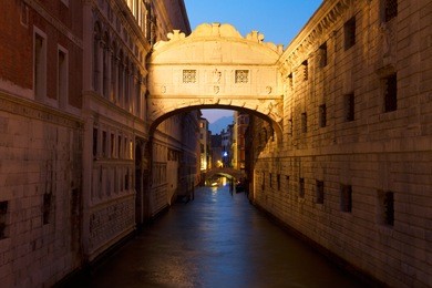 bridge of sighs over canal at night, venice, italy