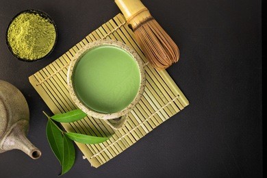 japanese matcha accessories and green tea in bowl