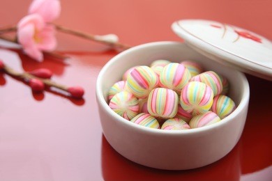 japanese traditional candy shaped like traditional japanese cotton handball, especially kyoto style confectionery on march for girl's festival in japan/ ball-shaped candy, japanese sweets