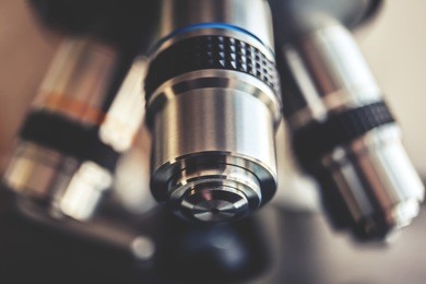 laboratory equipment - optical microscope.
microscope is used for conducting planned, research experiments, educational demonstrations in medical and health institutions, laboratories. close up photo.