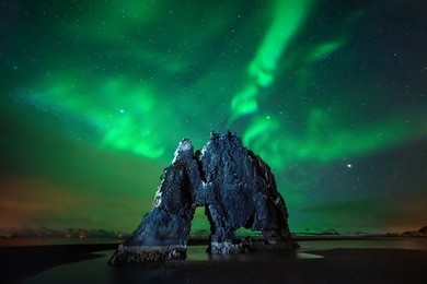 aurora borealis above hvitserkur rock formation, iceland 