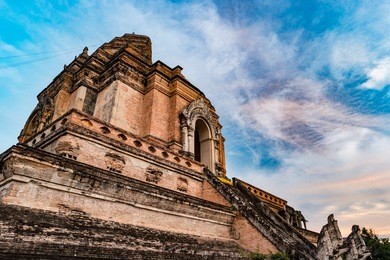 pagoda build from brick at wat chedi luang in chiang mai thailand. beautiful sunset photo of ancient asian architecture.