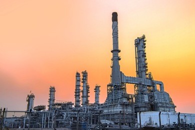 close up industrial view oil and gas refinery area with sunset and cloudy sky background