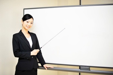 business woman explain at the whiteboard