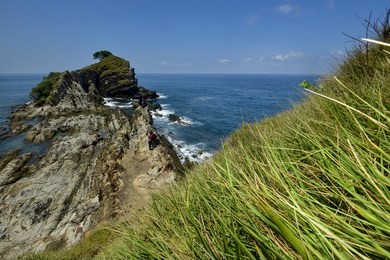 hidden beauty nature of kapas island located in malaysia, magical rock formation over blue sky background. selective focus image at sunny day