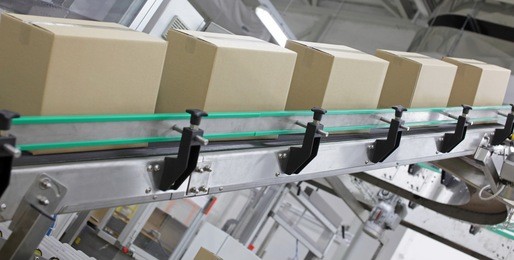 automation - cardboard boxes on conveyor belt in factory
