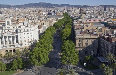 view of the ramblas, or la rambla street, in downtown barcelona from the memorial column of columbus in barceloneta, spain