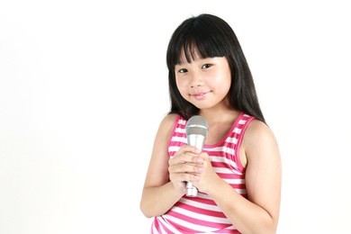 pretty little girl with the microphone in her hand