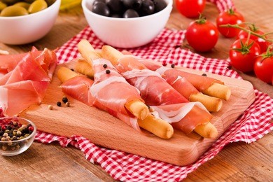 grissini breadsticks with ham. 