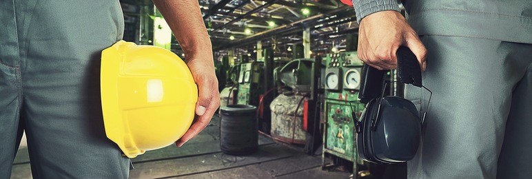workers with safety uniform at industrial factory