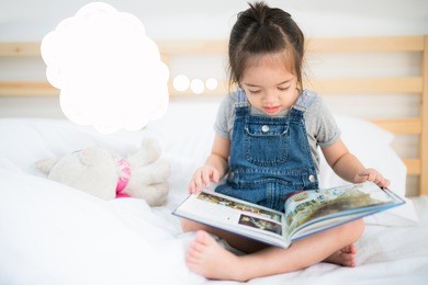 girl read a book on the bad, kid, idea, study and dream concept.
