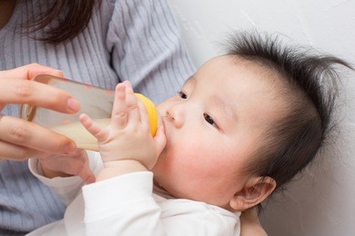 asian baby drinking