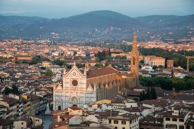 view of the basilica of the holy cross from the top of the palazzo vecchio in florence, italy.